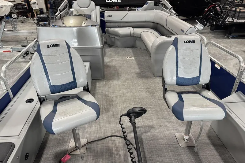 Slide: The Image of 2018 Lowe SF 214 Sport Fish boat interior with seating and steering console. - 6