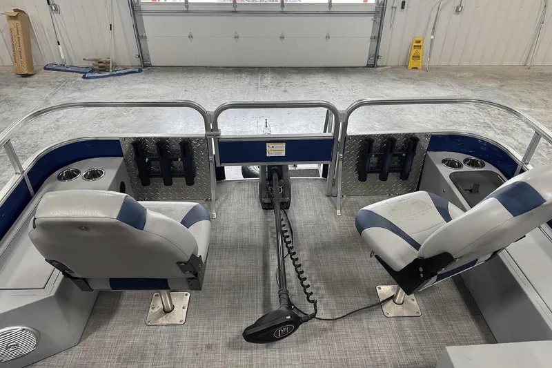 Slide: The Image of 2018 Lowe SF 214 Sport Fish boat interior with two seats and fishing rod holders. - 7
