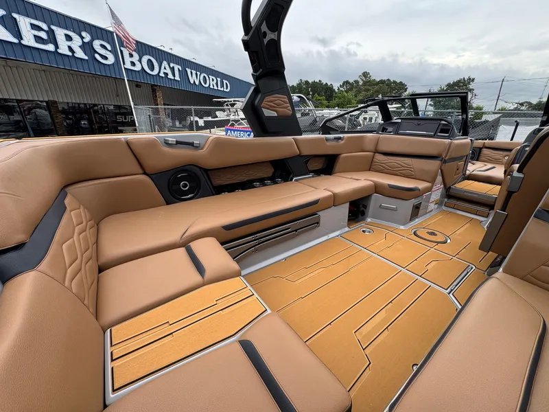 Slide: The Image of Interior of 2026 Supra SL 450 boat at dealership. - 19