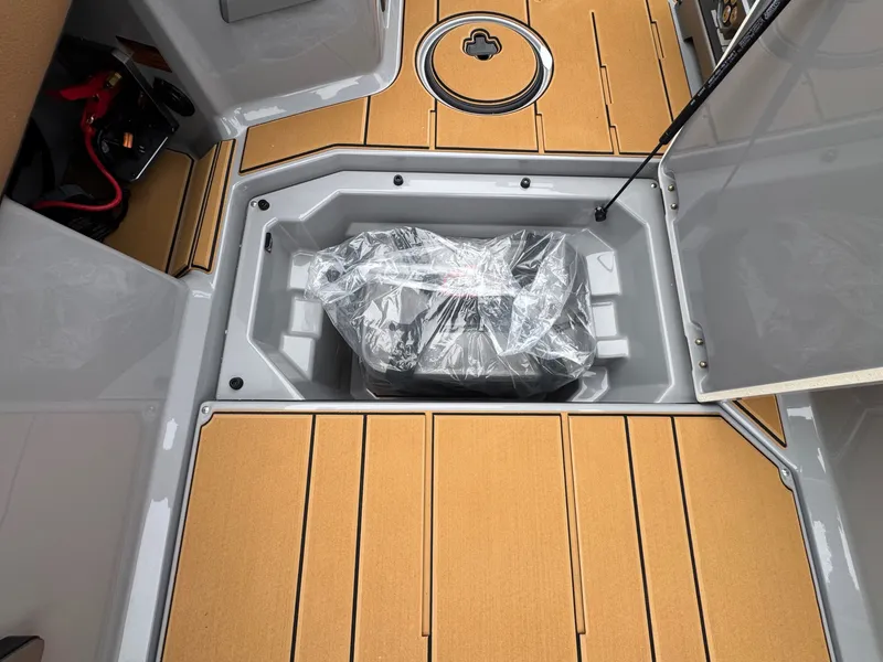 Slide: The Image of Storage compartment in 2026 Supra SL 450 boat. - 23