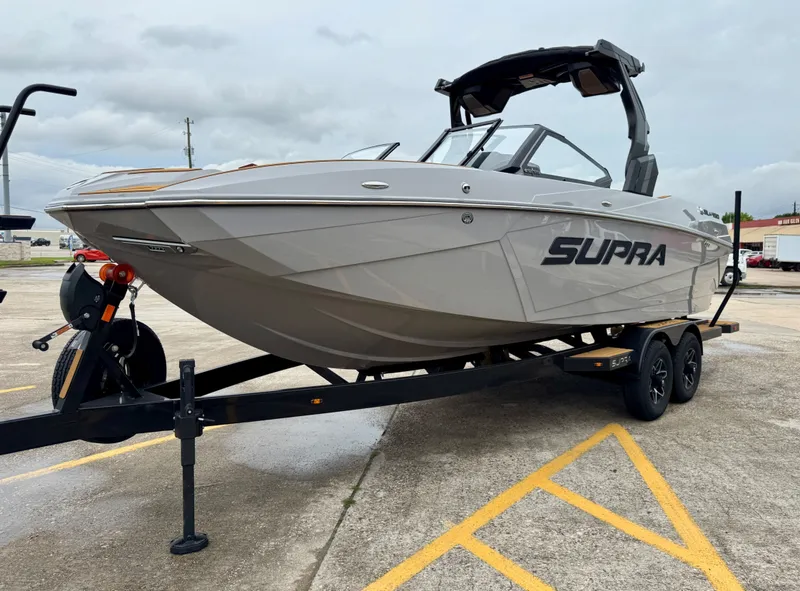 Slide: The Image of 2026 Supra SL 450 boat on trailer, gray color, side view. - 4