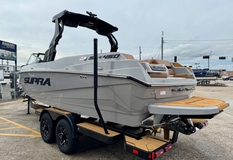 Slide: The Image of 2026 Supra SL 450 boat on trailer, side view. - 6