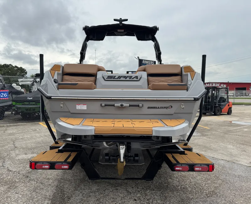Slide: The Image of Rear view of 2026 Supra SL 450 boat with Swell Surf system. - 8