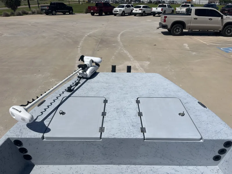 Slide: The Image of 2024 Freedom PATRIOT boat with Minn Kota trolling motor in parking lot. - 12