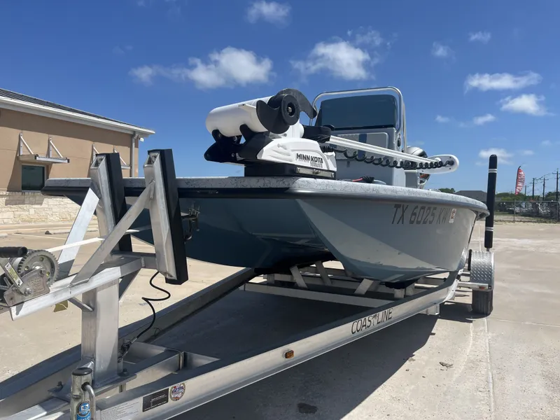 Slide: The Image of 2024 Freedom PATRIOT boat on trailer in sunny weather. - 3