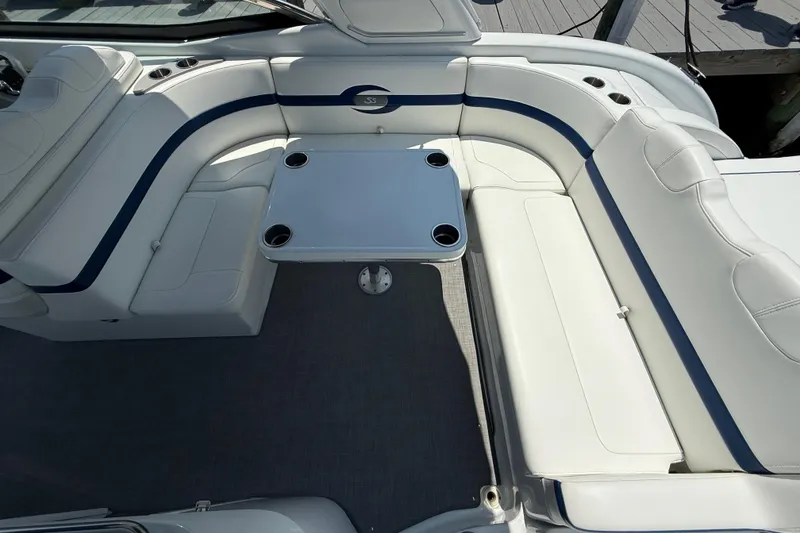 Slide: The Image of Luxurious seating area on a 2012 Formula 350 Sun Sport boat with a central table. - 10