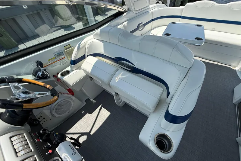 Slide: The Image of Interior of a 2012 Formula 350 Sun Sport boat with white seating and steering wheel. - 15