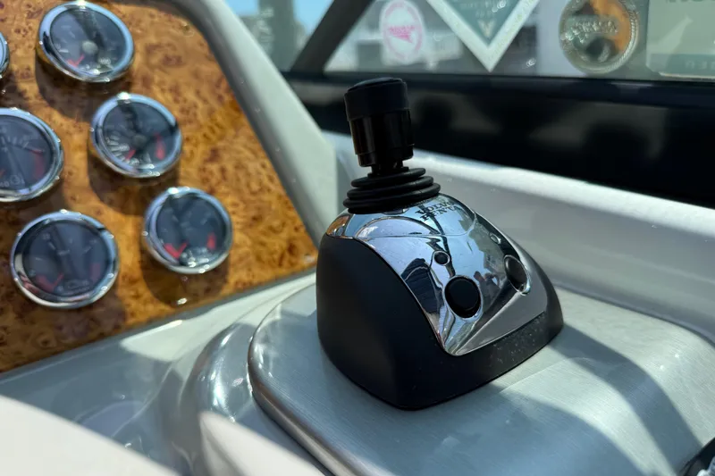 Slide: The Image of Control panel of a 2012 Formula 350 Sun Sport boat with gauges and joystick. - 18