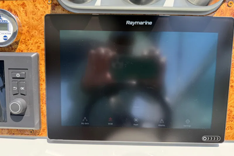 Slide: The Image of Raymarine display on 2012 Formula 350 Sun Sport dashboard with control panel. - 22