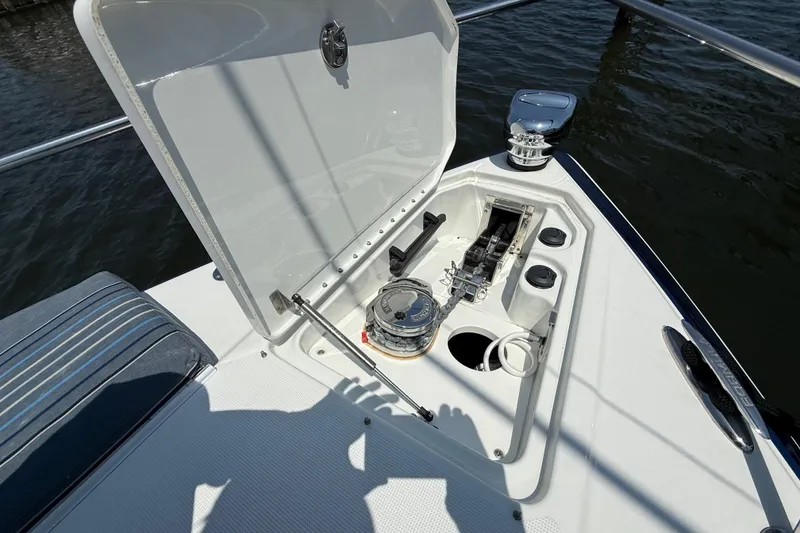 Slide: The Image of Open anchor compartment on 2012 Formula 350 Sun Sport boat, showing anchor and winch system. - 33