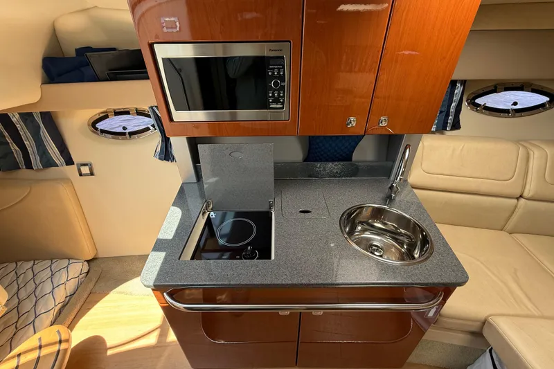 Slide: The Image of 2012 Formula 350 Sun Sport yacht interior with kitchenette, microwave, and sink. - 37