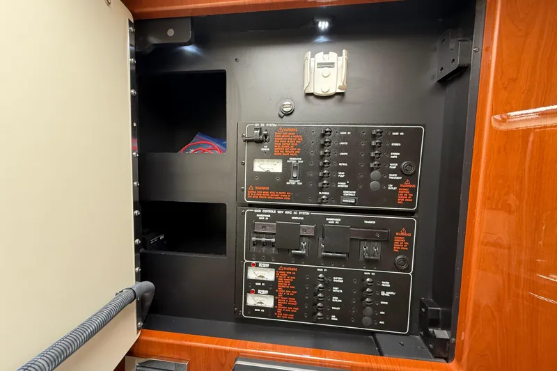 Slide: The Image of Electrical panel inside a 2012 Formula 350 Sun Sport boat, featuring various switches and controls. - 41