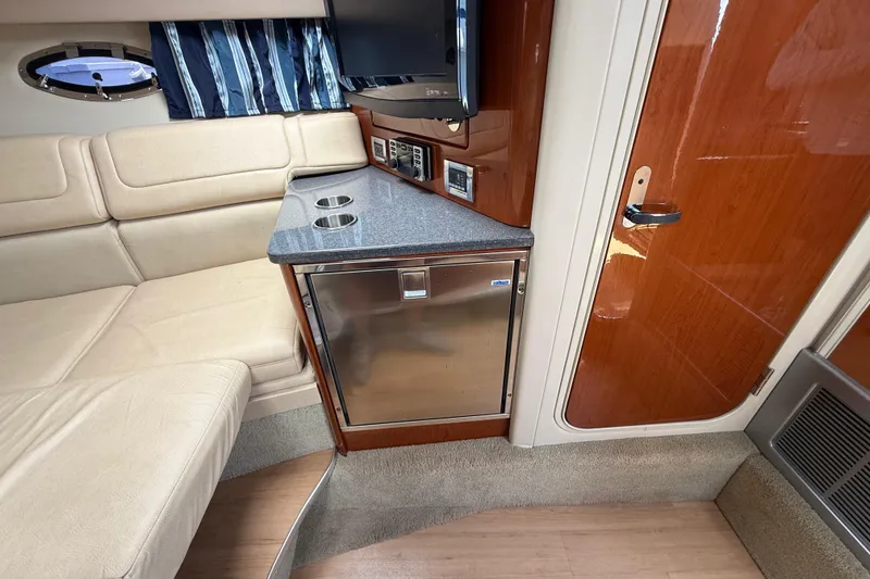 Slide: The Image of Interior of 2012 Formula 350 Sun Sport boat with seating, mini-fridge, and TV. - 43
