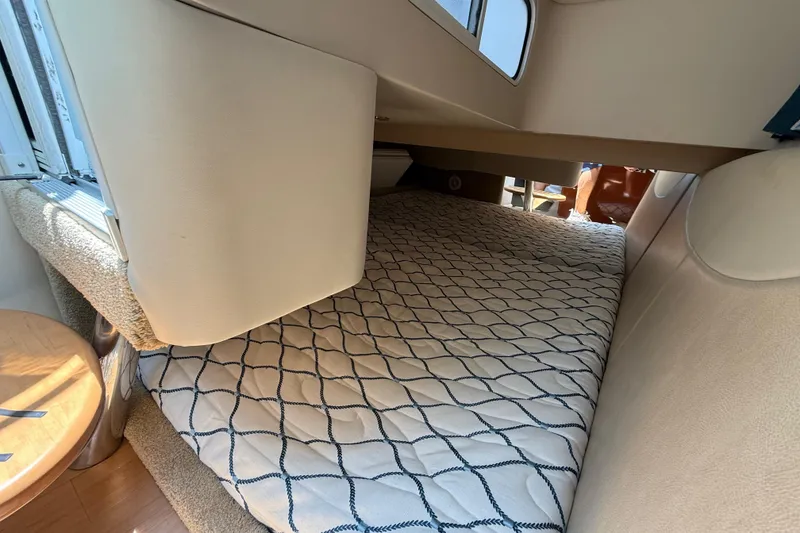 Slide: The Image of 2012 Formula 350 Sun Sport cabin interior with cozy bed and nautical decor. - 46