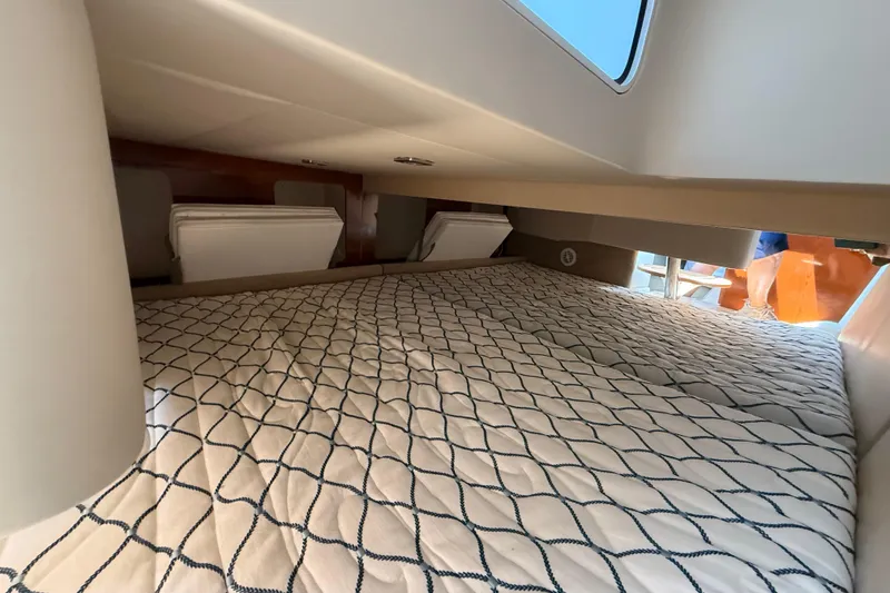 Slide: The Image of Interior cabin of 2012 Formula 350 Sun Sport with a cozy bed and window view. - 47
