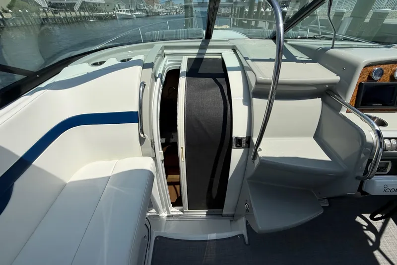 Slide: The Image of Interior view of a 2012 Formula 350 Sun Sport boat, featuring seating and helm area. - 48
