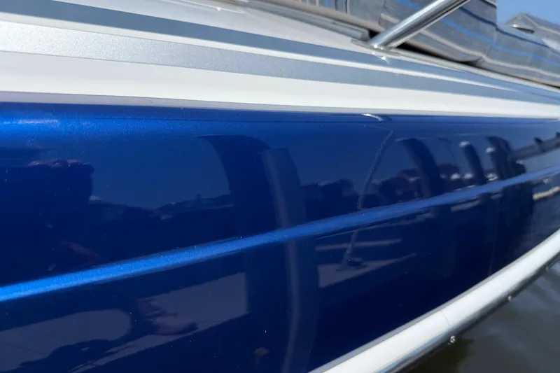 Slide: The Image of Close-up of a 2012 Formula 350 Sun Sport boat's sleek blue hull. - 49