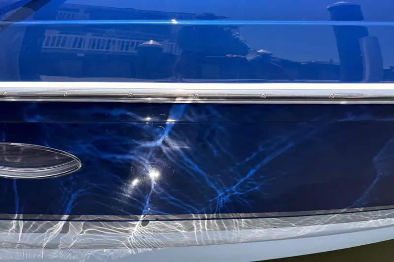 Slide: The Image of Close-up of a 2012 Formula 350 Sun Sport boat with blue reflective surface. - 51