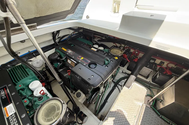 Slide: The Image of Engine compartment of a 2012 Formula 350 Sun Sport boat, showcasing dual Volvo Penta engines. - 55