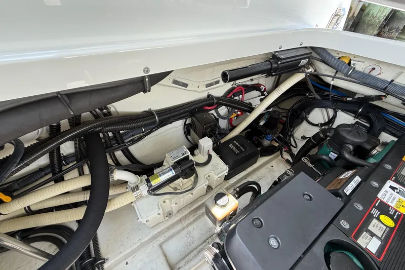 Slide: The Image of Engine compartment of a 2012 Formula 350 Sun Sport boat, showcasing wiring and components. - 57