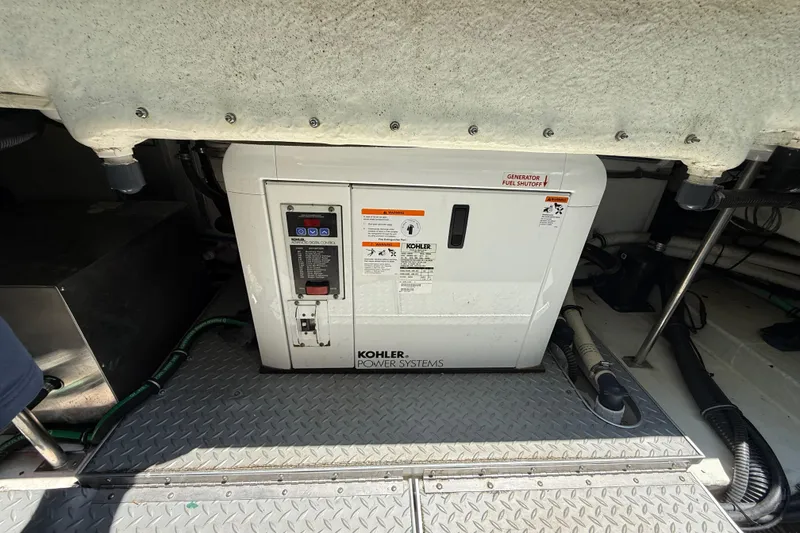 Slide: The Image of Kohler power generator in 2012 Formula 350 Sun Sport boat engine room. - 59
