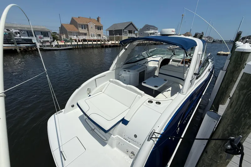 Slide: The Image of 2012 Formula 350 Sun Sport boat docked by waterfront homes. - 6