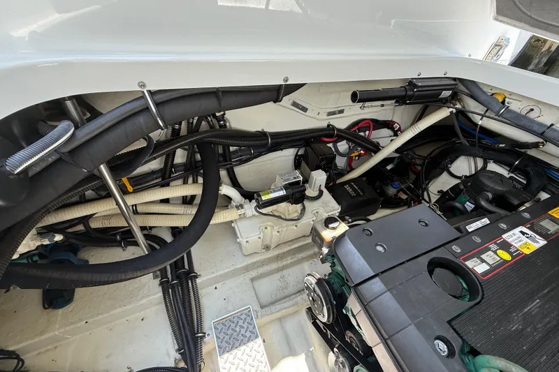 Slide: The Image of Engine compartment of a 2012 Formula 350 Sun Sport boat, showcasing wiring and components. - 60