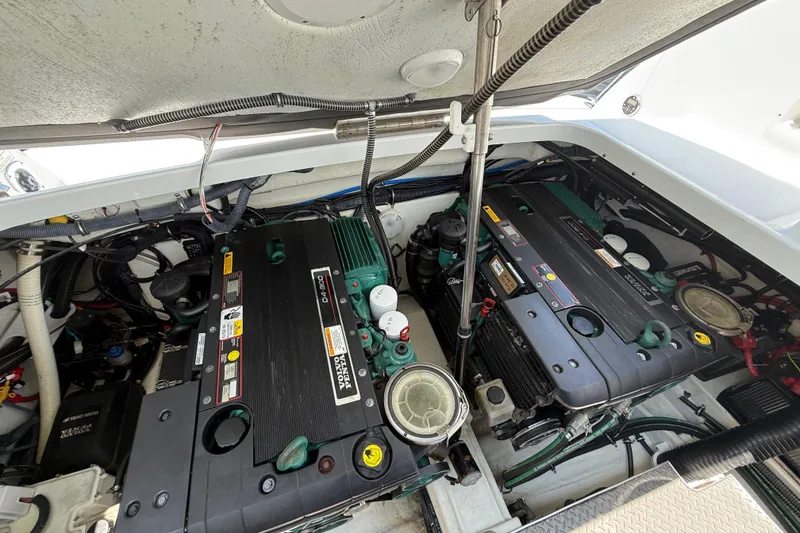 Slide: The Image of Engine compartment of a 2012 Formula 350 Sun Sport boat, showcasing dual engines. - 61