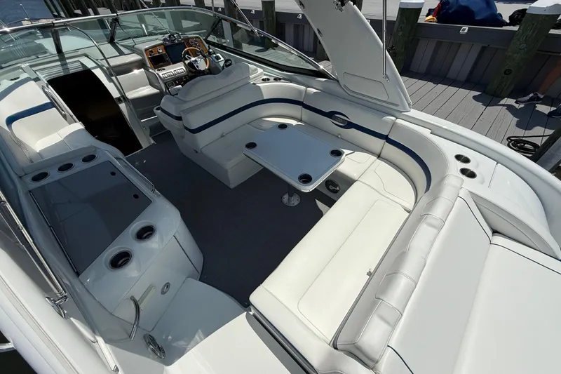 Slide: The Image of 2012 Formula 350 Sun Sport boat interior with white seating and control panel. - 9