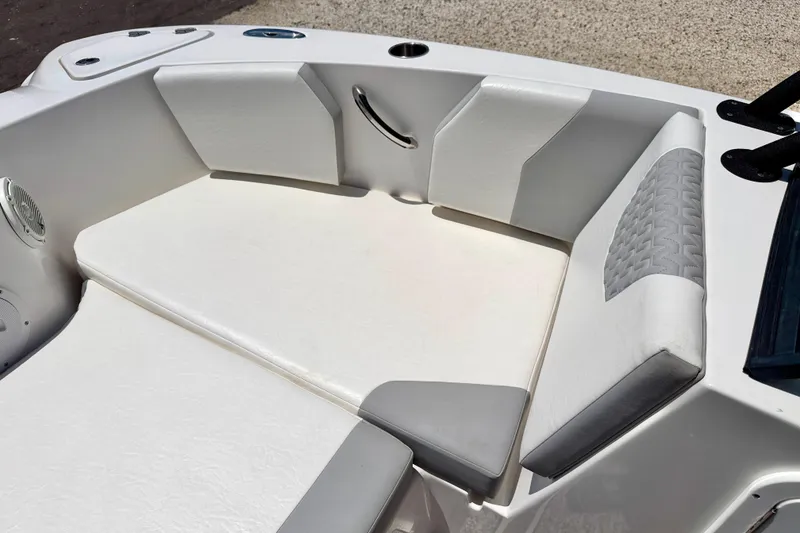 Slide: The Image of 2021 Twin Vee 240 GFX DC boat interior with cushioned seating and modern design. - 10