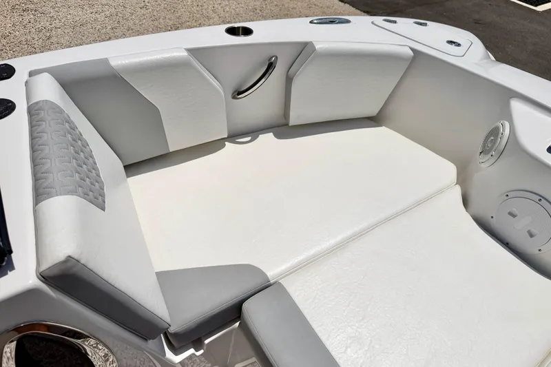 Slide: The Image of 2021 Twin Vee 240 GFX DC boat interior with white cushioned seating. - 11