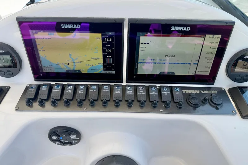 Slide: The Image of Dashboard of 2021 Twin Vee 240 GFX DC boat with Simrad navigation displays. - 15