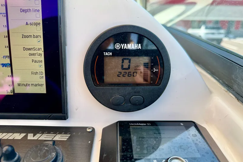 Slide: The Image of Yamaha tachometer on 2021 Twin Vee 240 GFX DC boat dashboard, displaying 2260 RPM. - 17