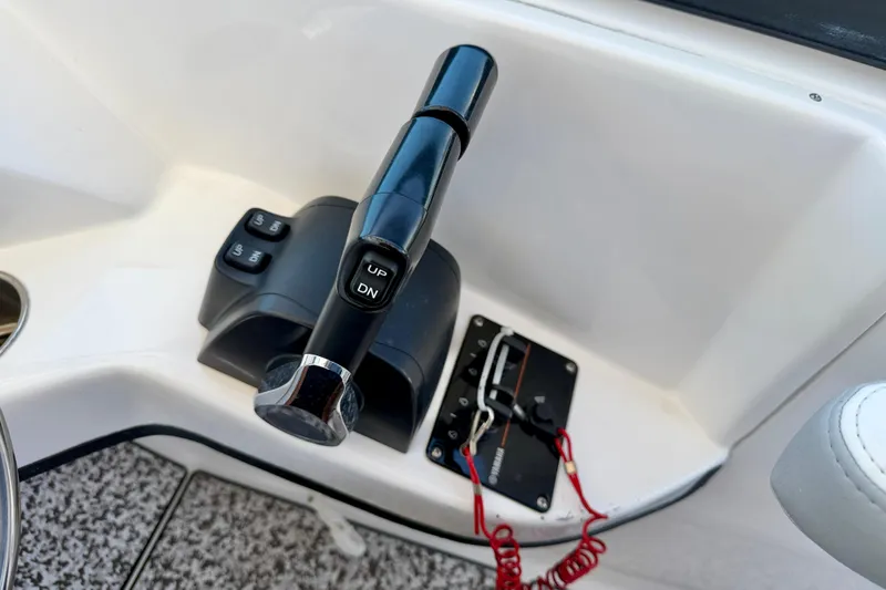 Slide: The Image of Throttle control panel of 2021 Twin Vee 240 GFX DC boat with buttons and safety lanyard. - 20