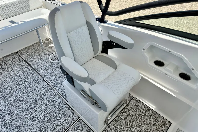 Slide: The Image of 2021 Twin Vee 240 GFX DC boat interior with cushioned seating and textured flooring. - 23
