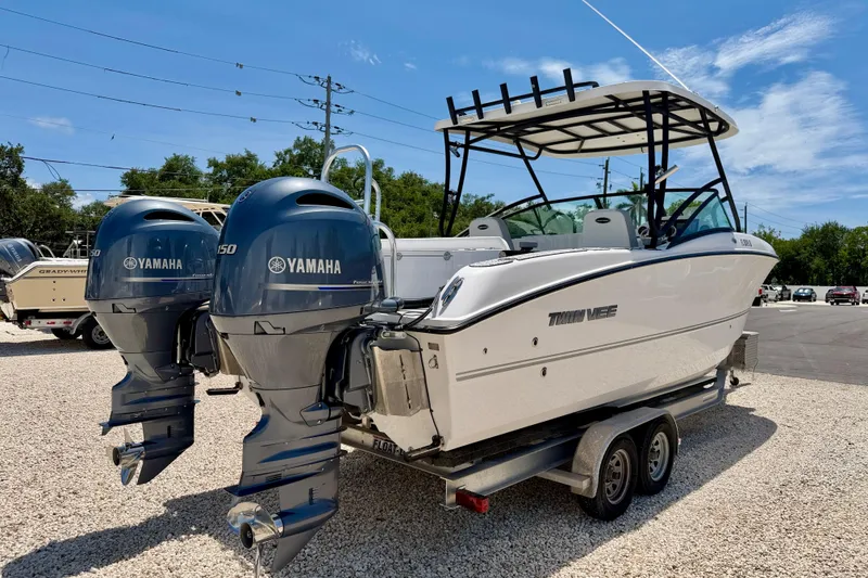 Slide: The Image of 2021 Twin Vee 240 GFX DC boat with dual Yamaha engines on a trailer. - 5