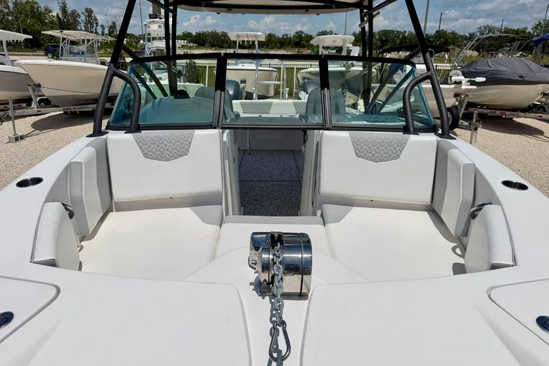 Slide: The Image of 2021 Twin Vee 240 GFX DC boat interior with seating and anchor chain. - 8