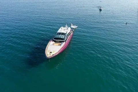 Slide: The Image of Luxury Baia ONE HUNDRED yacht from 2011 cruising on calm blue waters. - 73