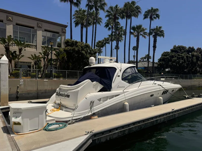 Slide: The Image of 2008 Sea Ray Sundancer yacht docked at marina with palm trees in background. - 43