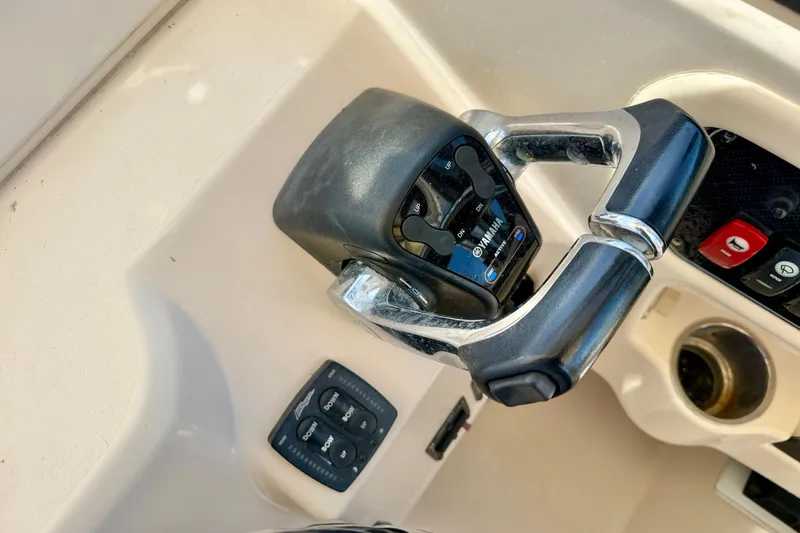 Slide: The Image of Close-up of 2016 Grady-White Journey 258 boat controls with Yamaha throttle. - 15