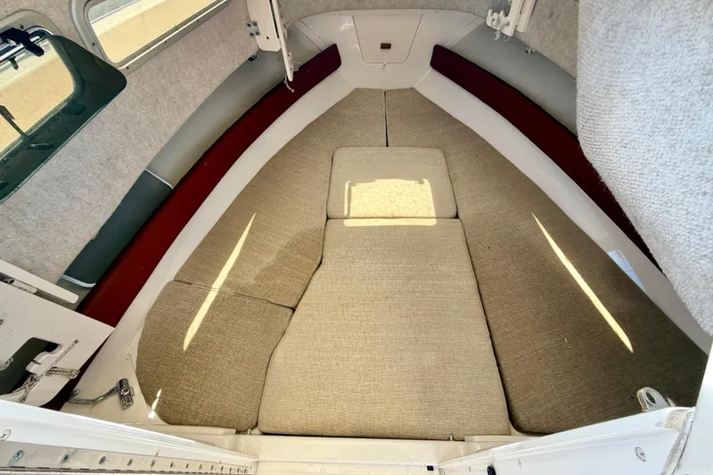 Slide: The Image of Interior cabin of 2016 Grady-White Journey 258 boat with beige cushions. - 23