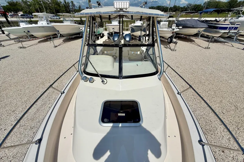 Slide: The Image of 2016 Grady-White Journey 258 boat on display, surrounded by other boats. - 27