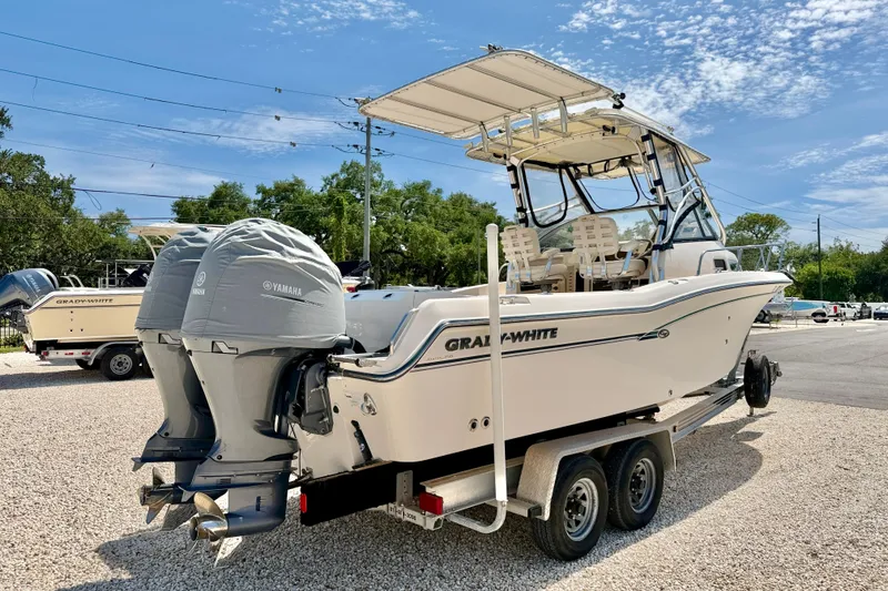 Slide: The Image of 2016 Grady-White Journey 258 boat with twin Yamaha engines on a trailer. - 5