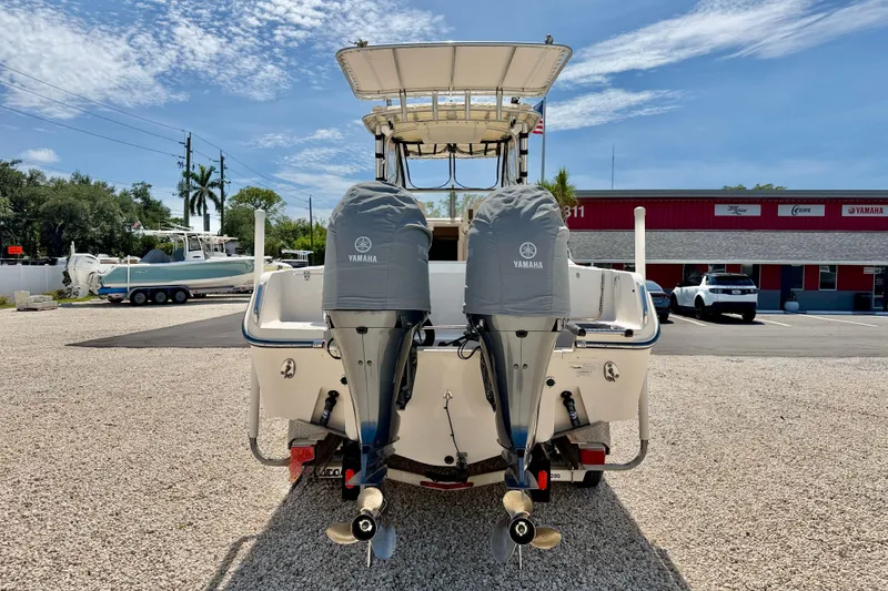 Slide: The Image of 2016 Grady-White Journey 258 boat with twin Yamaha engines in a dealership lot. - 6