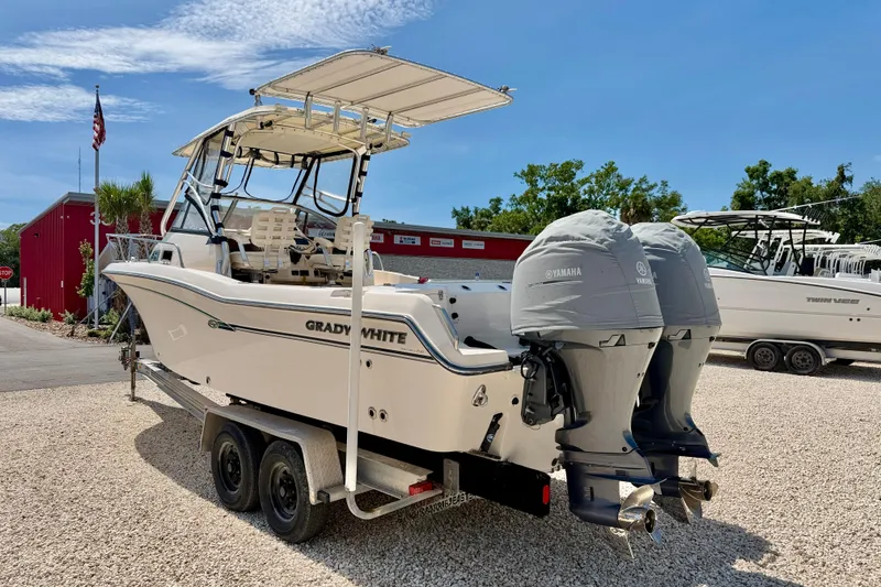 Slide: The Image of 2016 Grady-White Journey 258 boat with twin Yamaha engines on a trailer. - 7