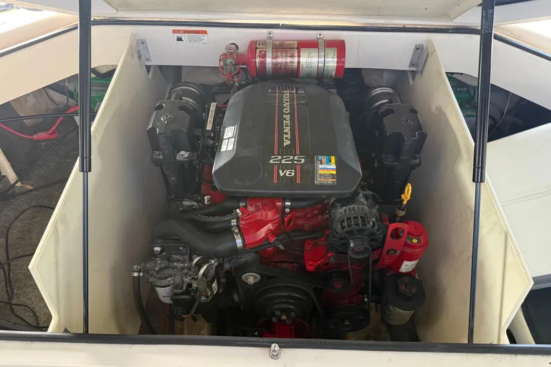 Slide: The Image of Engine compartment of a 2013 Regal 2100 Bowrider featuring a Volvo Penta 225 V6 engine. - 18