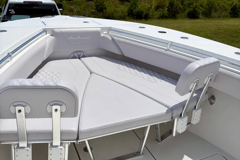 Slide: The Image of 2024 SeaHunter 31 Tournament boat with cushioned seating and sleek design. - 11
