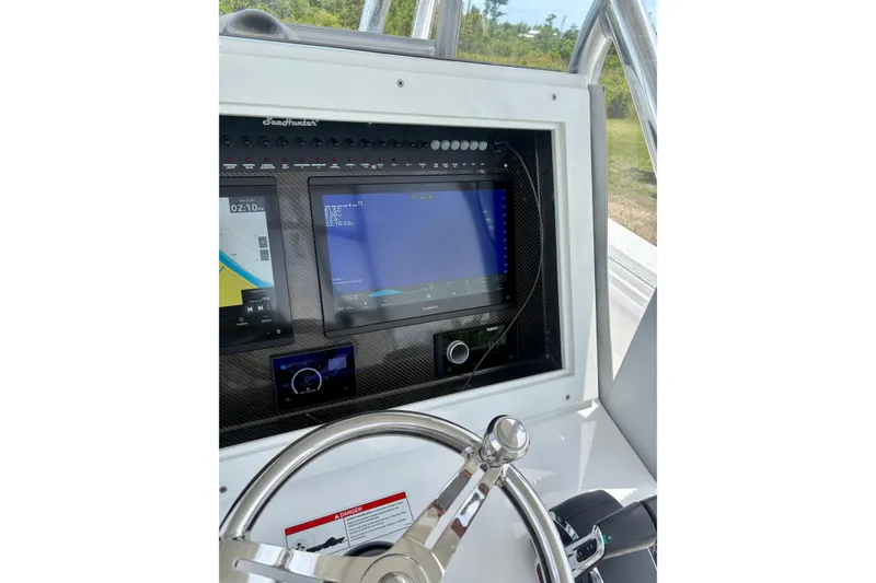 Slide: The Image of 2024 SeaHunter 31 Tournament dashboard with advanced navigation and control systems. - 14