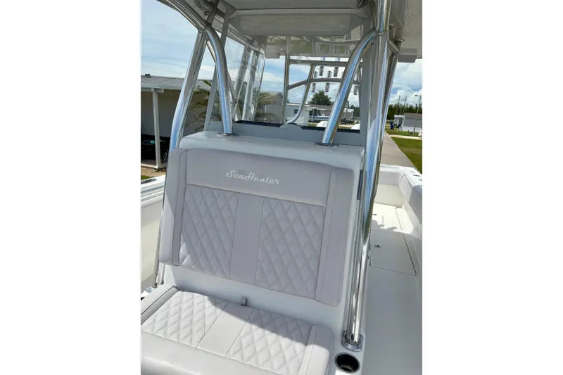 Slide: The Image of 2024 SeaHunter 31 Tournament boat interior with cushioned seating and stainless steel frame. - 17