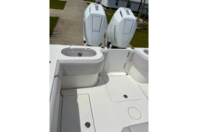 Slide: The Image of 2024 SeaHunter 31 Tournament boat with dual Mercury engines, spacious deck view. - 24